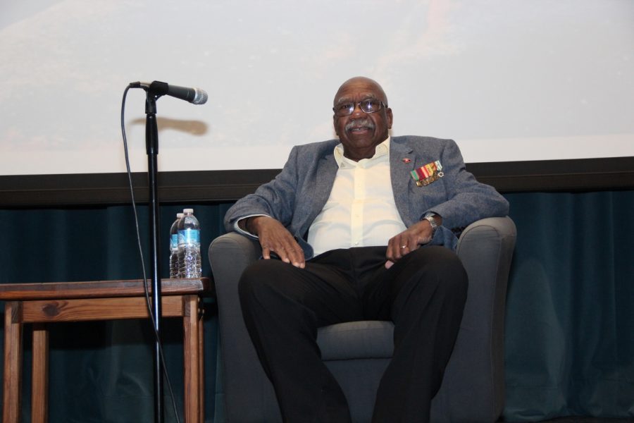 Charles Person sitting down in front of a crowd of 300 plus on Friday.