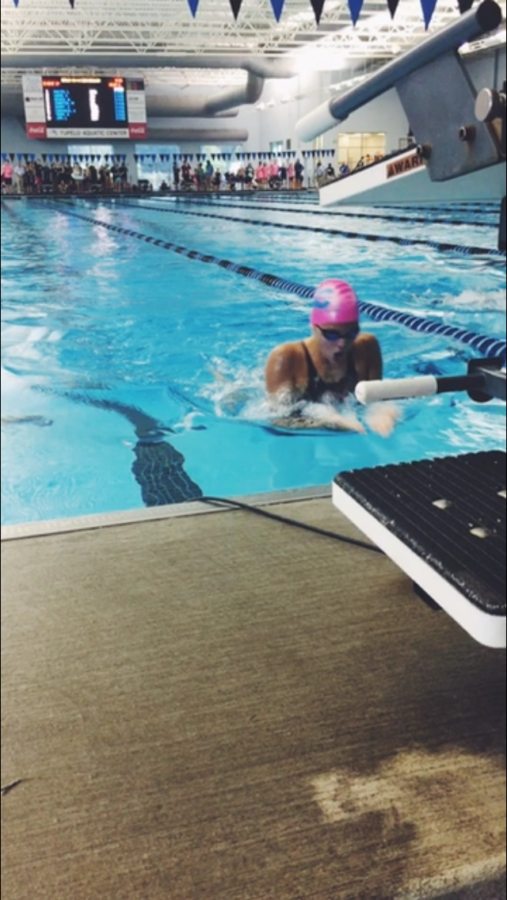 Hohm swims breaststroke at a swim meet for the Aquatic Team of Mecklenburg (ATOM).