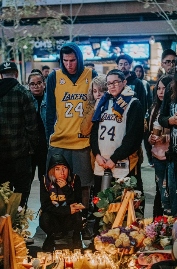 People in LA gather together in front of Staples Center to mourn the death of Kobe Bryant