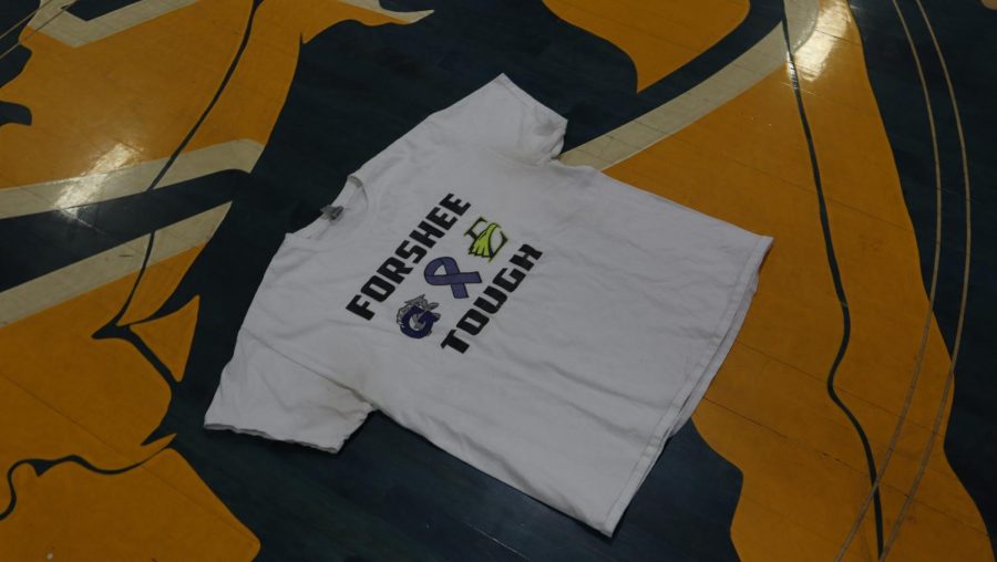 Forshee Tough T-shirt laying at the center of the basketball court