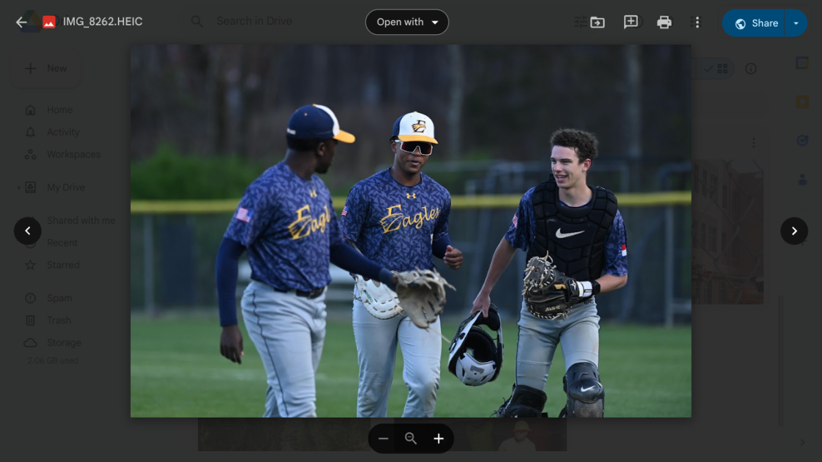 Liam Parsons, Jacob Addison and Jeremiah Golden share a moment during a baseball game.