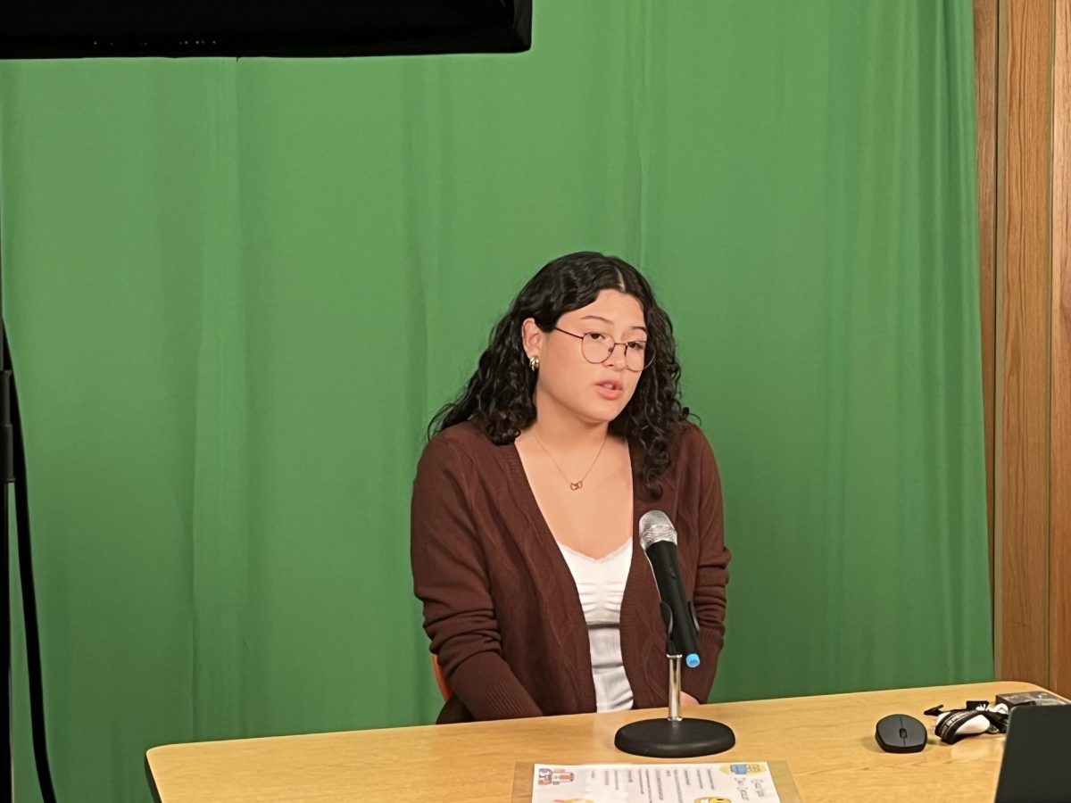 In the Eagle Media Center, Any Izuela Chicas records the next day's news. 