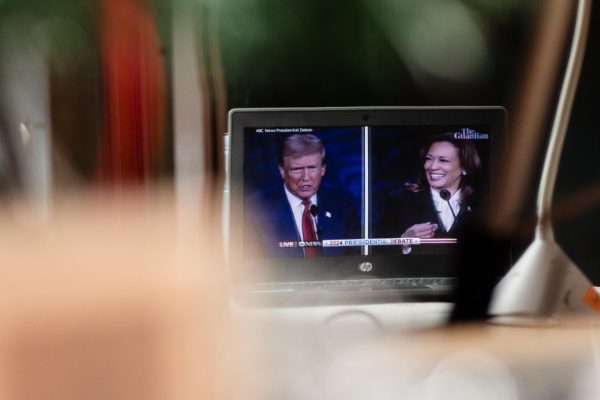 Students watch the 2024 presidential debate in a Chormebook. 