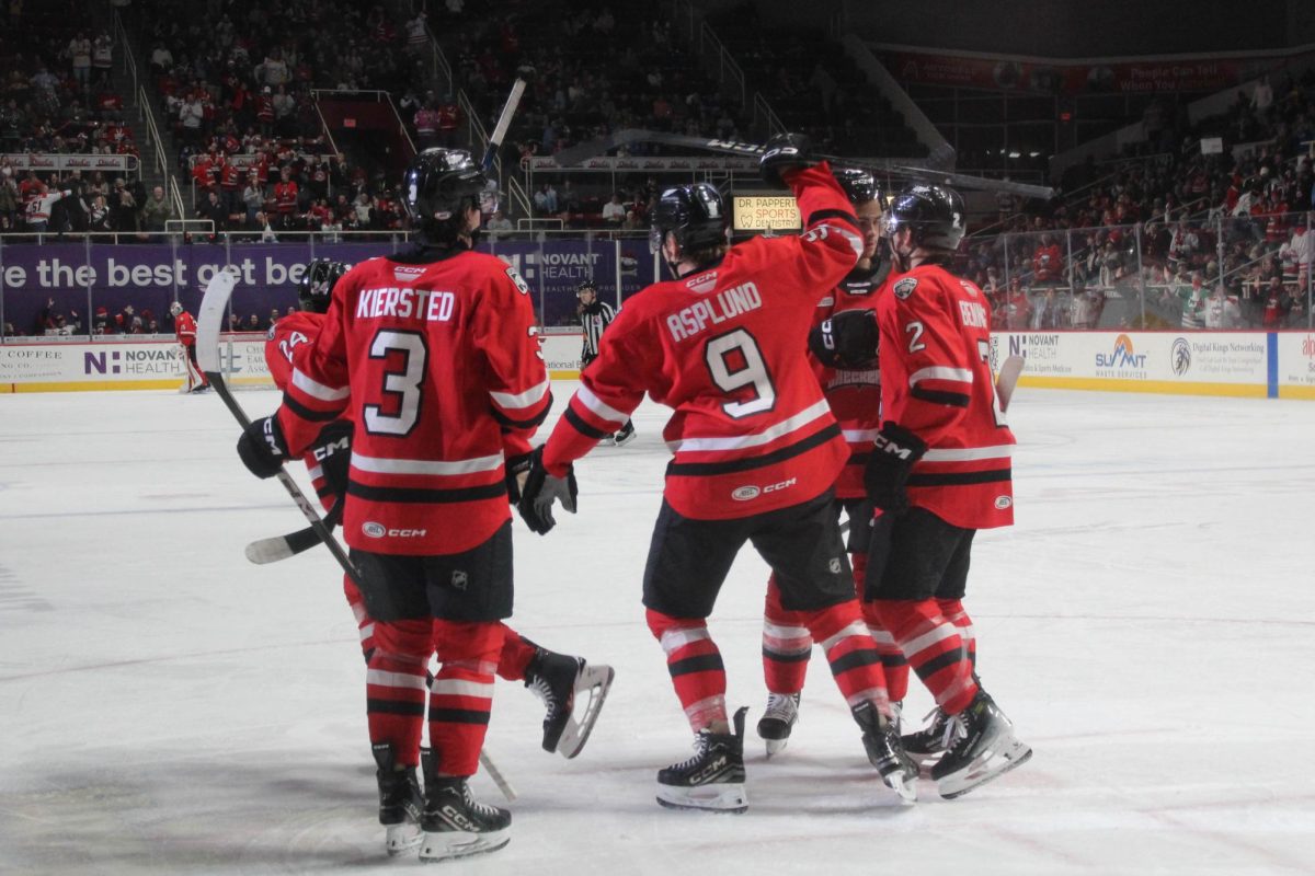 Checkers players celebrate a goal mid-game