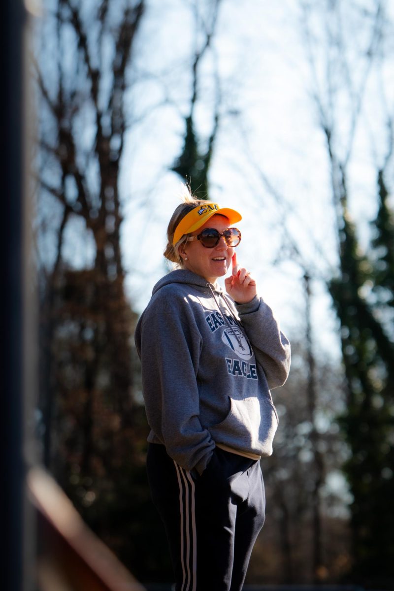 Coach Hawkins, East Meck's softball coach, observes the potential team for the 2025 season.