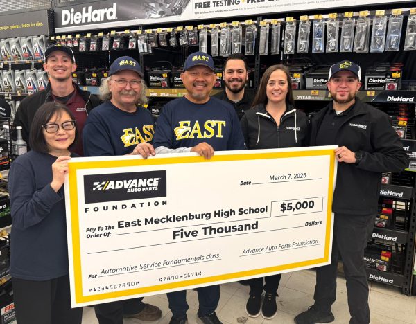 Christina Cooper (Left), John Shefte (Middle) and Thomas Nguyen (Right) pose for a picture with staff from the Advanced Auto Parts Foundation.
(Photo courtesy of Christina Cooper and the Advance Auto Parts Foundation)