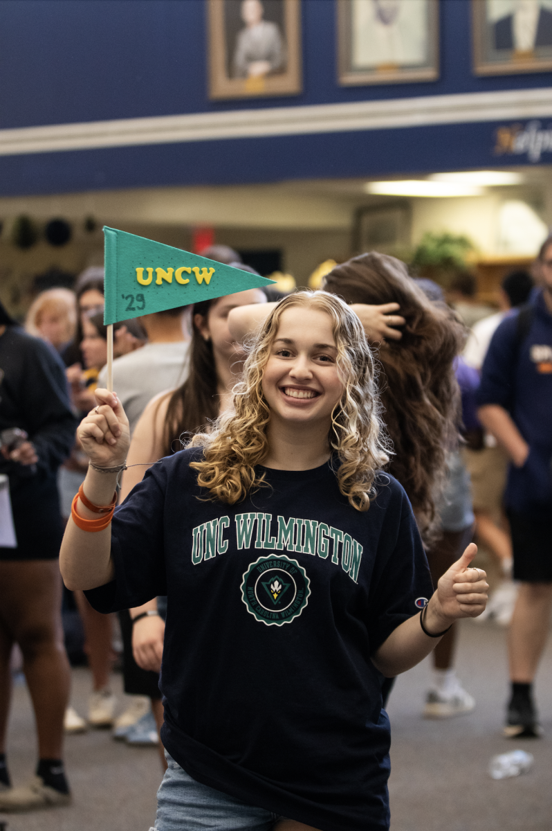 Ola Ombach celebrates her decision to UNCW. Class of 25 Decision day is being celebrated in the library.