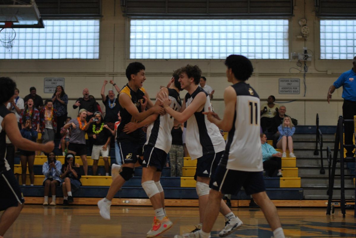 The boys' volleyball team wins on match point over Palisades. In their inaugural season, they have shocked East Meck with their playing abilities and winning record. 