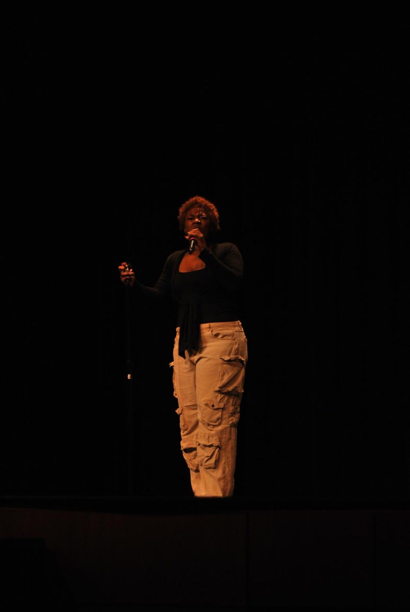 Destynni Davis performs an R&B song at the NAACP talent show. Davis has begun singing publicly this past school year, even performing the national anthem at an Eagles basketball game.
