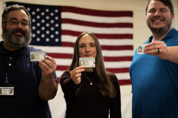 Watts, Komito and Miller pose with their drivers licenses.