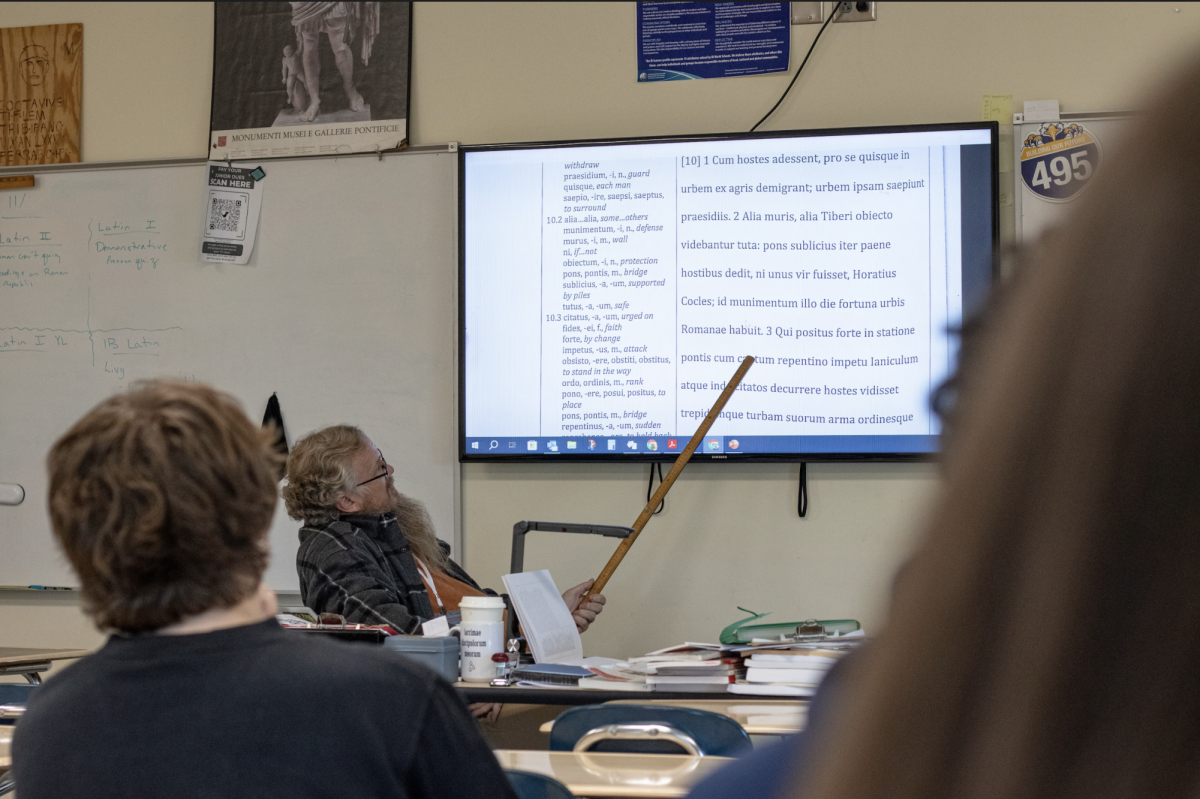 Latin teacher Deric Oates teaches his IB Latin class. Oates teaches all six levels of Latin offered, including IB SL and HL.