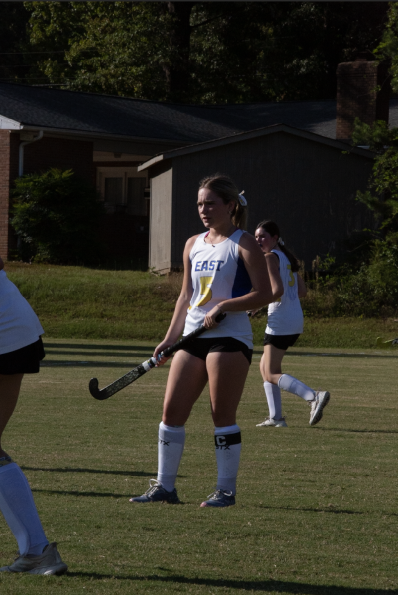 Sydney Edwards carefully watches her teammates during a field hockey match versus Covenant Day. Edwards attends North Iredell High School and is a center forward on the team.
