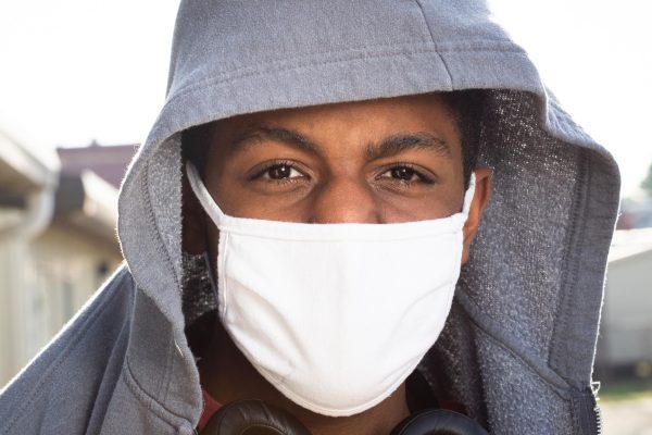 Student, Levi Martin, wears a mask during COVID-19 at East Meck High school in 2021. COVID-19 was a pandemic that affected students and school world-wide.